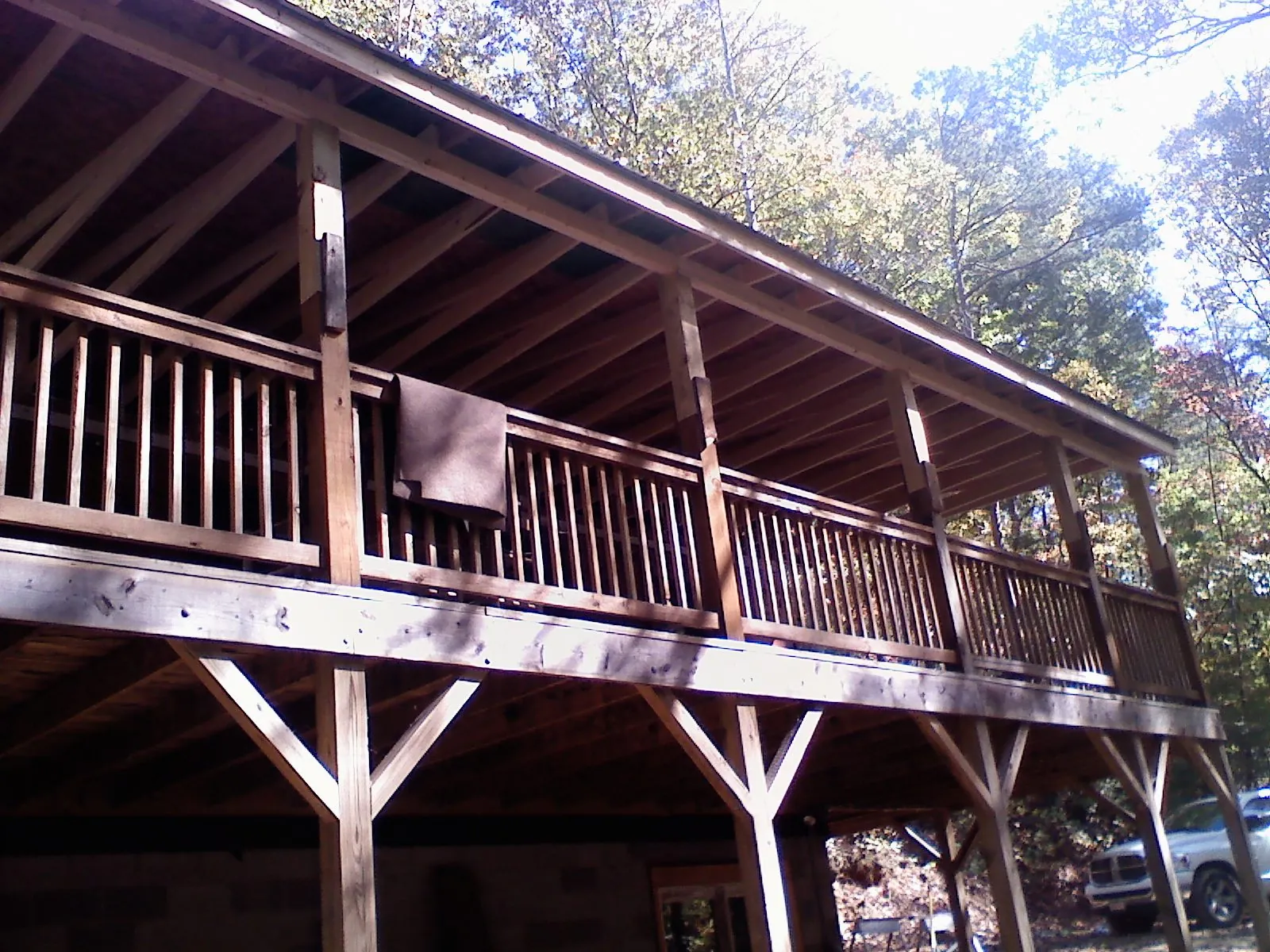 Timber framing under a new elevated porch and deck — Roof Leak Repair in Port Washington by Roofing Brothers